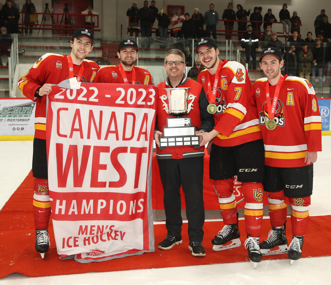 Dakota Krebs and the rest of the Dinos leadership group celebrate their Canada West championship. 