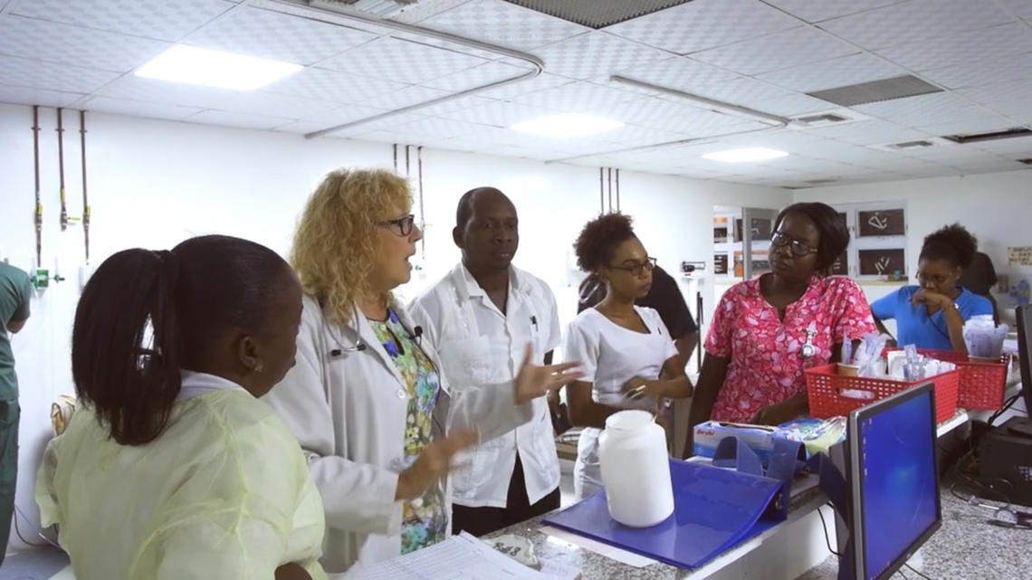 Karen Then, RN PhD, speaks with a group of nurses in training as part of the Guyana Program to Advance Cardiac Care. Photos courtesy Project 7 Media Group