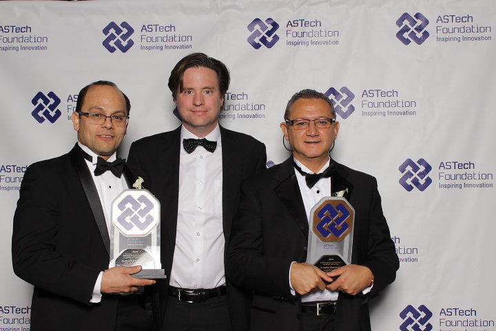 Bill Rosehart, dean of the Schulich School of Engineering, centre, celebrates with Alex Ramirez-Serrano, left, and Fadhel Ghannouchi after the two faculty members were announced as recipients of ASTech Leadership Foundation Awards on Oct. 24. 