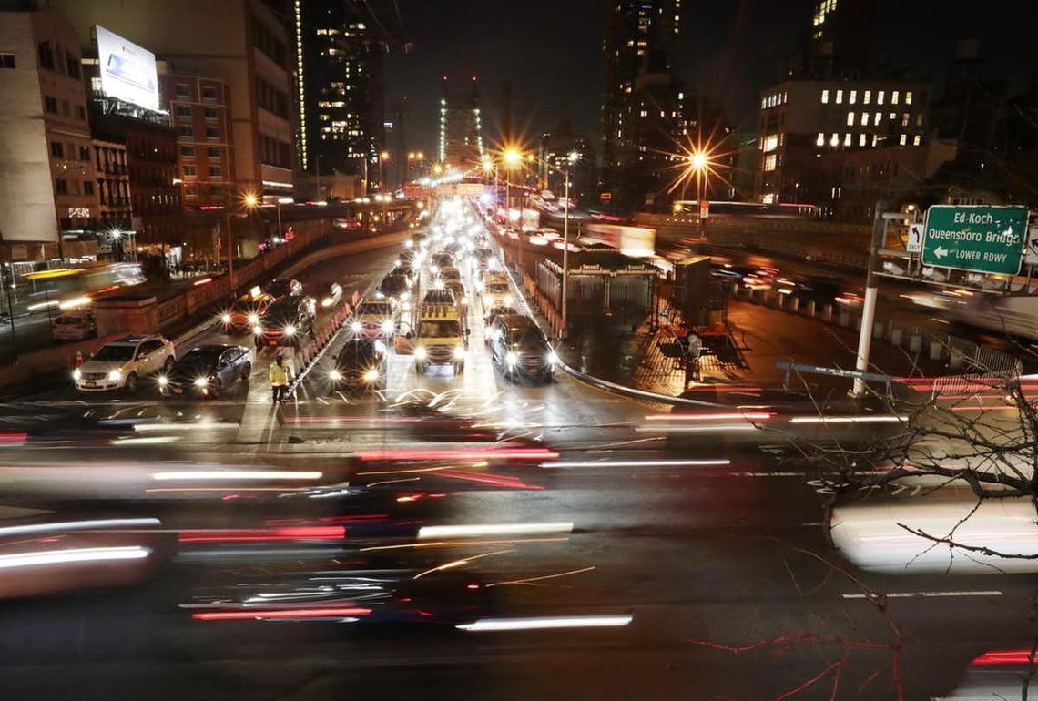 Cars pass the Queensboro Bridge in New York. Drivers for the ride-hailing giant Uber are planning a national day of action to protest labour conditions.