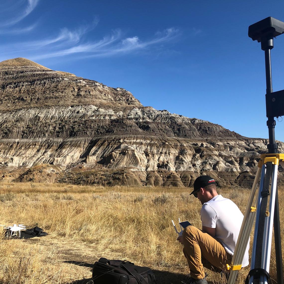 Dr. Paul Nesbit prepares to launch a drone at the Drumheller field site. The images acquired were the foundation for the Virtual Outcrop Model constructed for the study