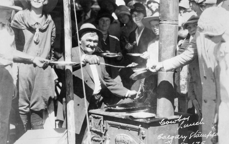  Horace Inkster, serving pancakes at Calgary Exhibition and Stampede street breakfast, Calgary, Alberta.