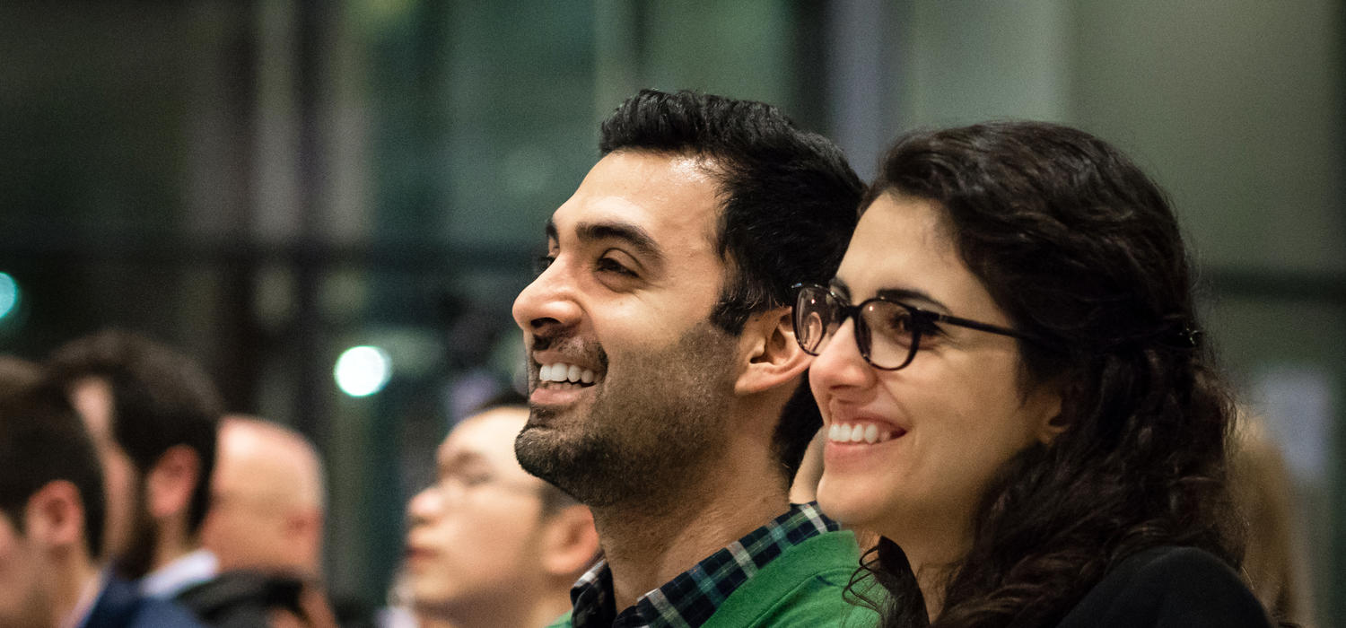Ashkan Tehrani and Negar Mohammadi look on during the award ceremony at the Innovation4Health Hack Competition.