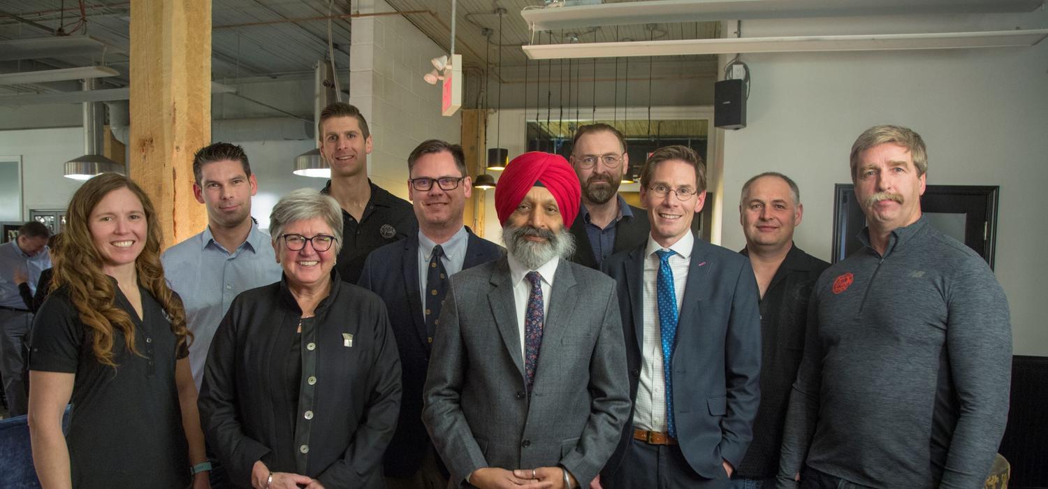 Celebrating the Calgary Firefighters Burn Treatment Society's $1 million renewal of its Chair in Skin Regeneration and Wound Healing, held by Jeff Biernaskie, are, from left: Tara Walmsley, Thomas Kerr, Dru Marshall,  Trevor Huggins, Duncan Nickerson, Baljit Singh, Vincent Gabriel, Jeff Biernaskie, Todd Nabozniak, and Rod Griffith. Photo by Colleen De Neve, for the University of Calgary