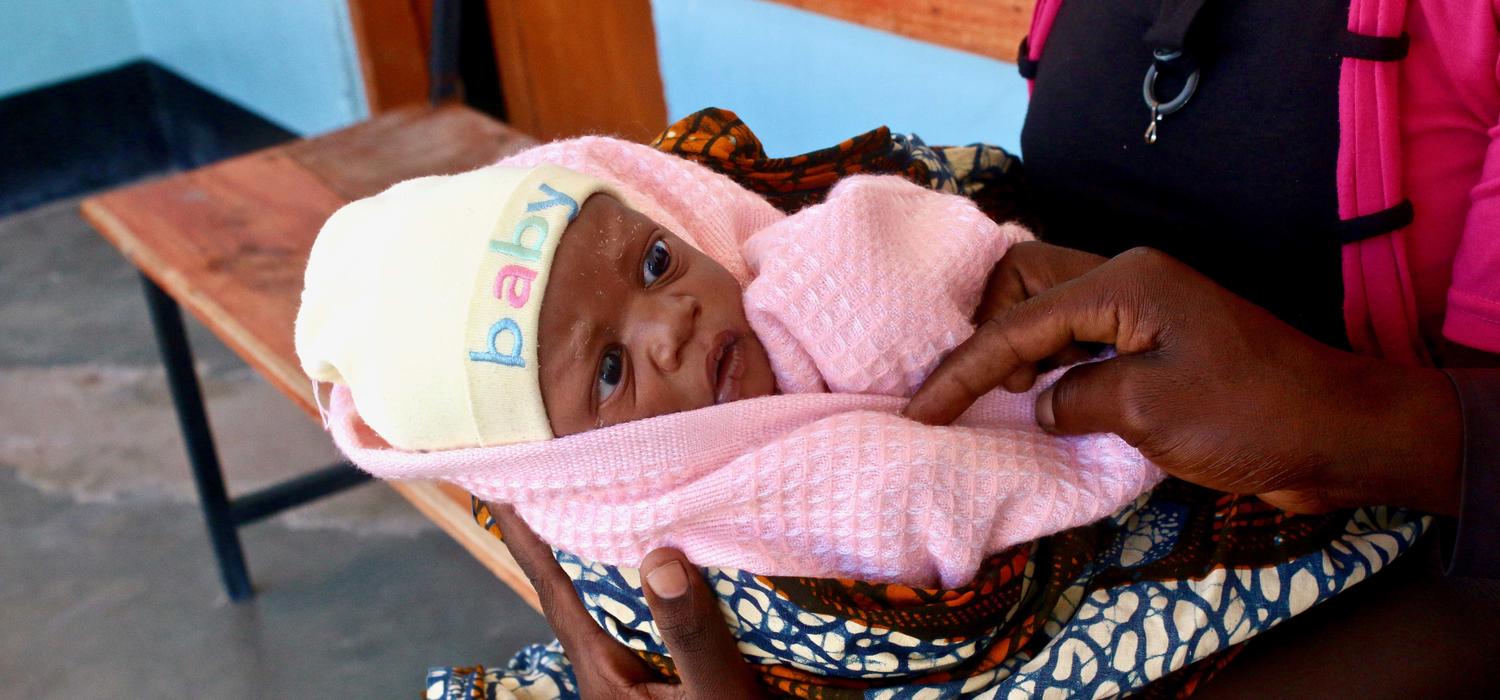 Known locally as Mama na Mtoto (mother and baby in Swahili), UCalgary's Cumming School of Medicine project provides on-the-ground clinical, education and research support to help mothers and babies. Here, a two-day-old baby awaits a checkup at a health facility in Misunwi District, Tanzania. Photo by Ashley Anderson