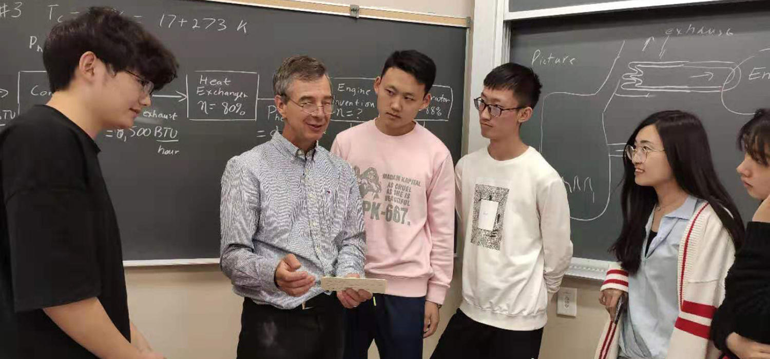 Associate Professor Ed Nowicki and CISP students in engineering classroom 
