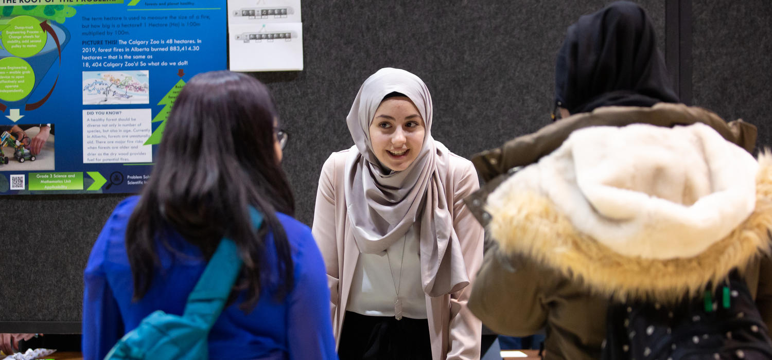 Bachelor of Education student Raneem Elhowari explains the role robots can play in preventing forest fires at the recent Werklund School STEM showcase. Photo by Riley Brandt, University of Calgary