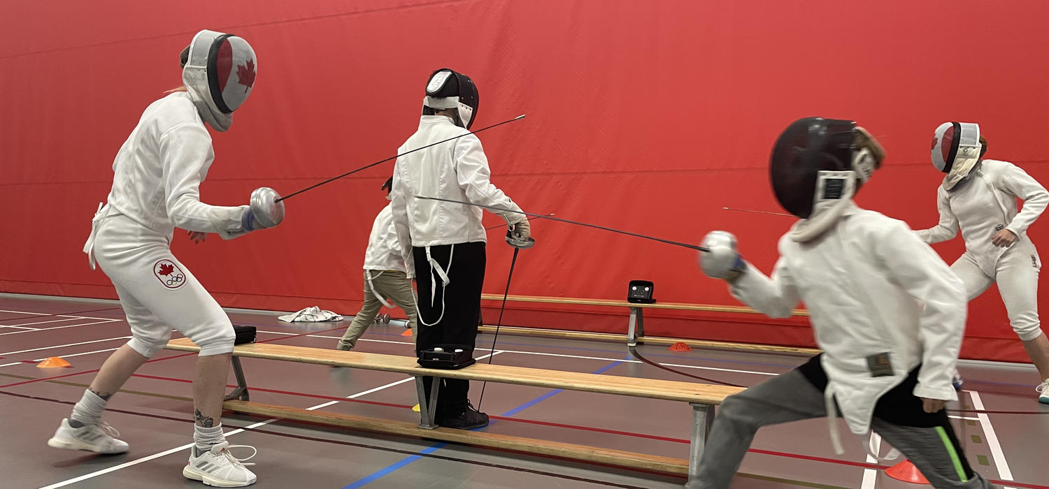 Complete with full gear, electronic scoring, and officials Olympic fencers Alanna Goldie and Kelleigh dueled with kids in Active Living's fencing summer camp.