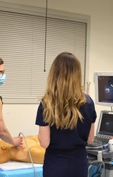 Group of physicians training on the Point-of-care Ultrasound equipment