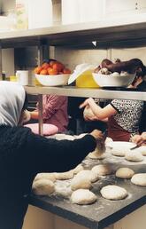 Yazidi women baking at Rockpointe Community Church