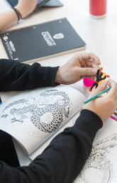 A student holding an example of a sensory-friendly toy.