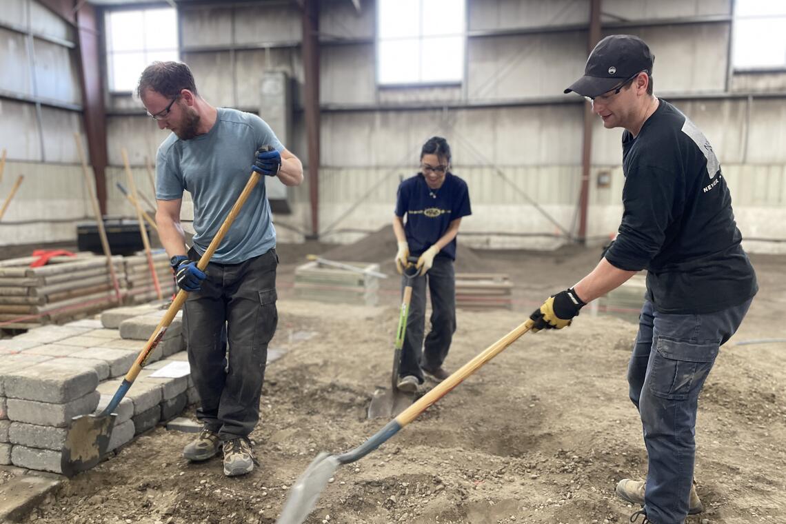 SAPL MLA students working on a construction project.