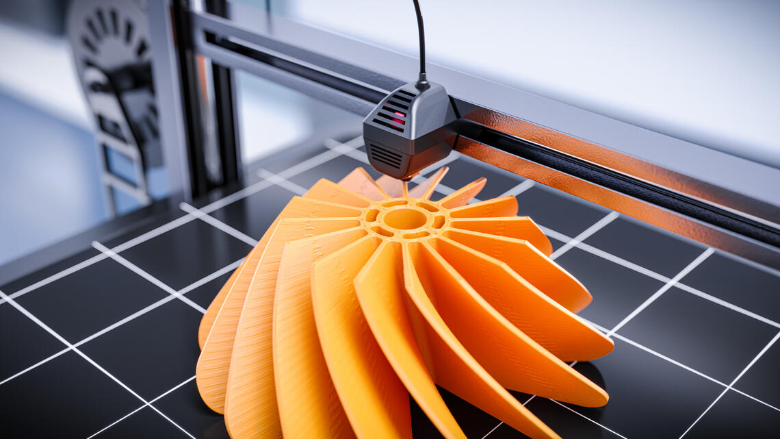 A 3D printer printing a prototype of a model turbine.