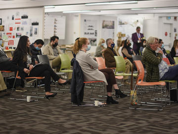 Conference participants watch panel discussion