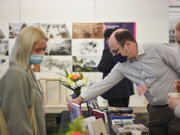 Conference participants view research display